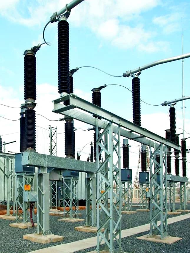 High-voltage switchyard and substation transformer infrastructure.